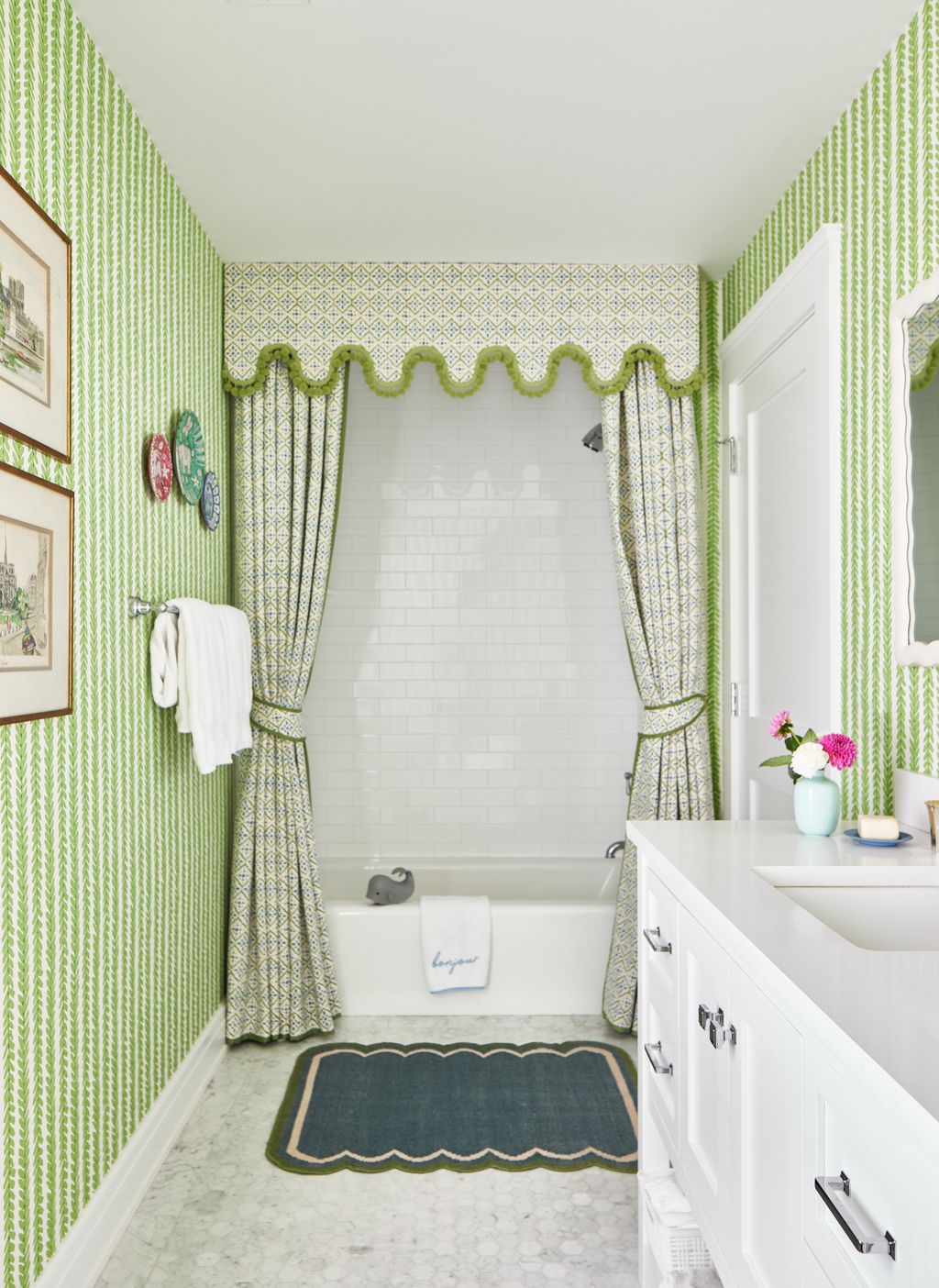 Bright shades of green can make smaller windowless bathrooms feel light and uplifting. In the children's bathroom of...