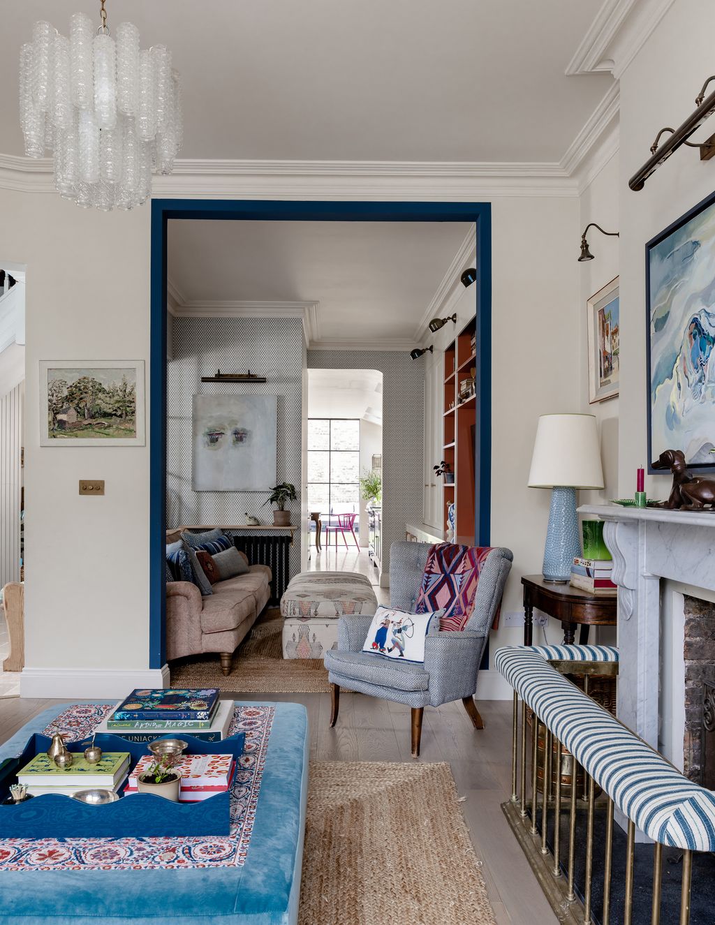 Opening up the doorways between the frontfacing sitting room the tv snug and the kitchen extension at the back of the...