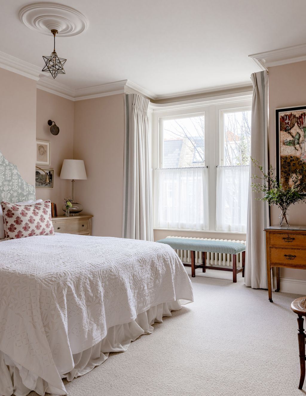 The walls of the main bedroom are painted in ‘Clover by Edward Bulmer making for a light neutral space.