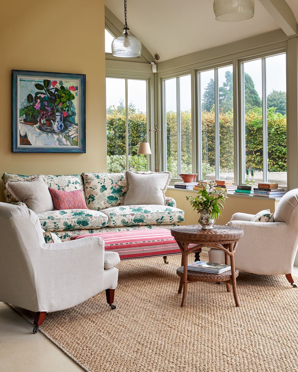 In the sitting area in the kitchen painted in “Cord” by Farrow  Ball features two “Colridge” chairs from OKA.