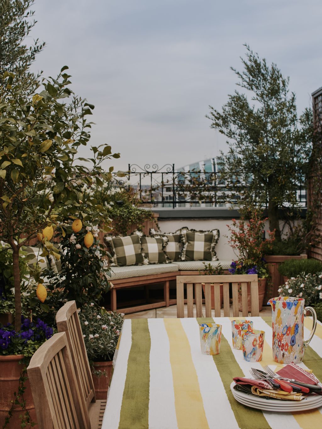 The original terrace covered the whole footprint of the apartment but the new design zones it into separate dining and...