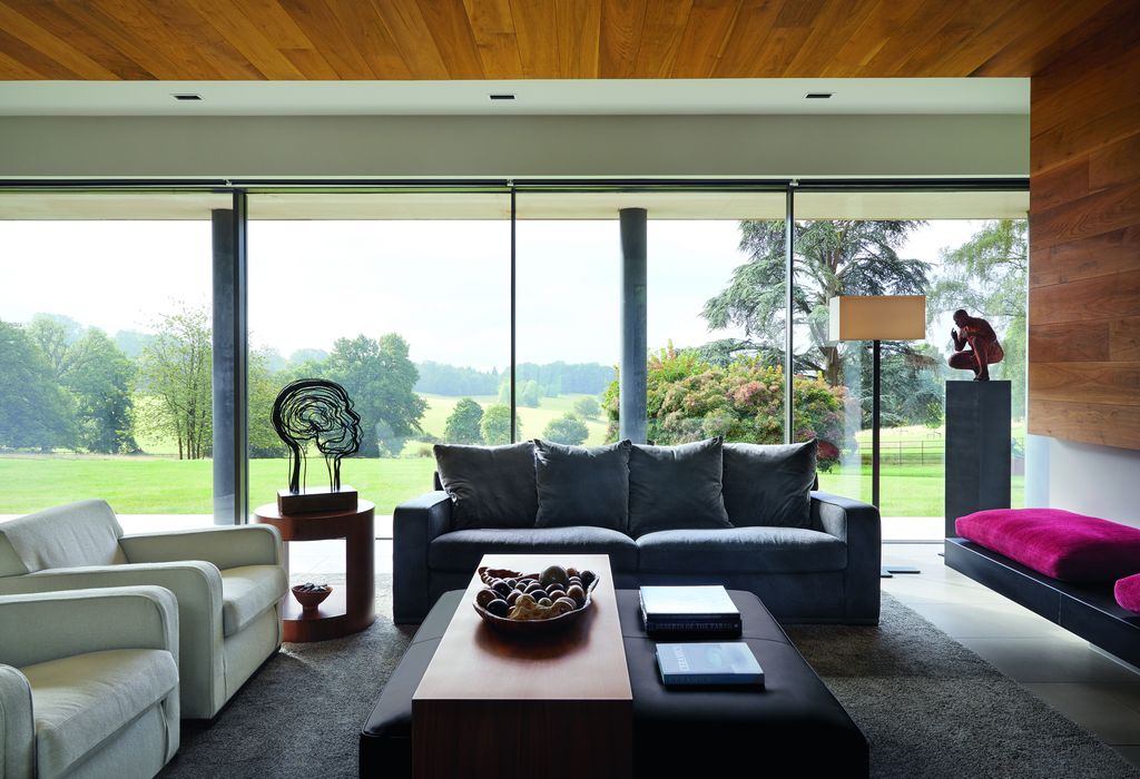 An ‘Imprimatur sofa and armchairs in ‘Semio fabric in two colourways and a leathercovered ‘Intervallum ottoman all from...