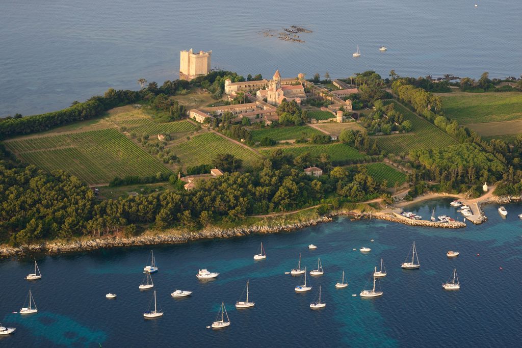 Just off the coast of the Cap d'Antibes is the teeny Île SaintHonorat whose inhabitants are exclusively comprised of a...
