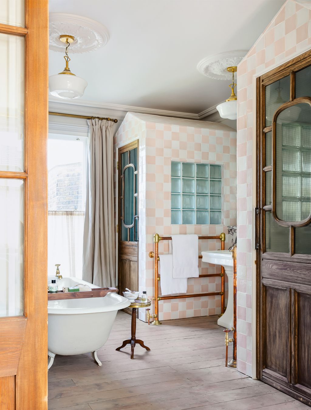 Having the luxury of a spacious bathroom offers the option of building enclosures within the room to house  a loo and a...