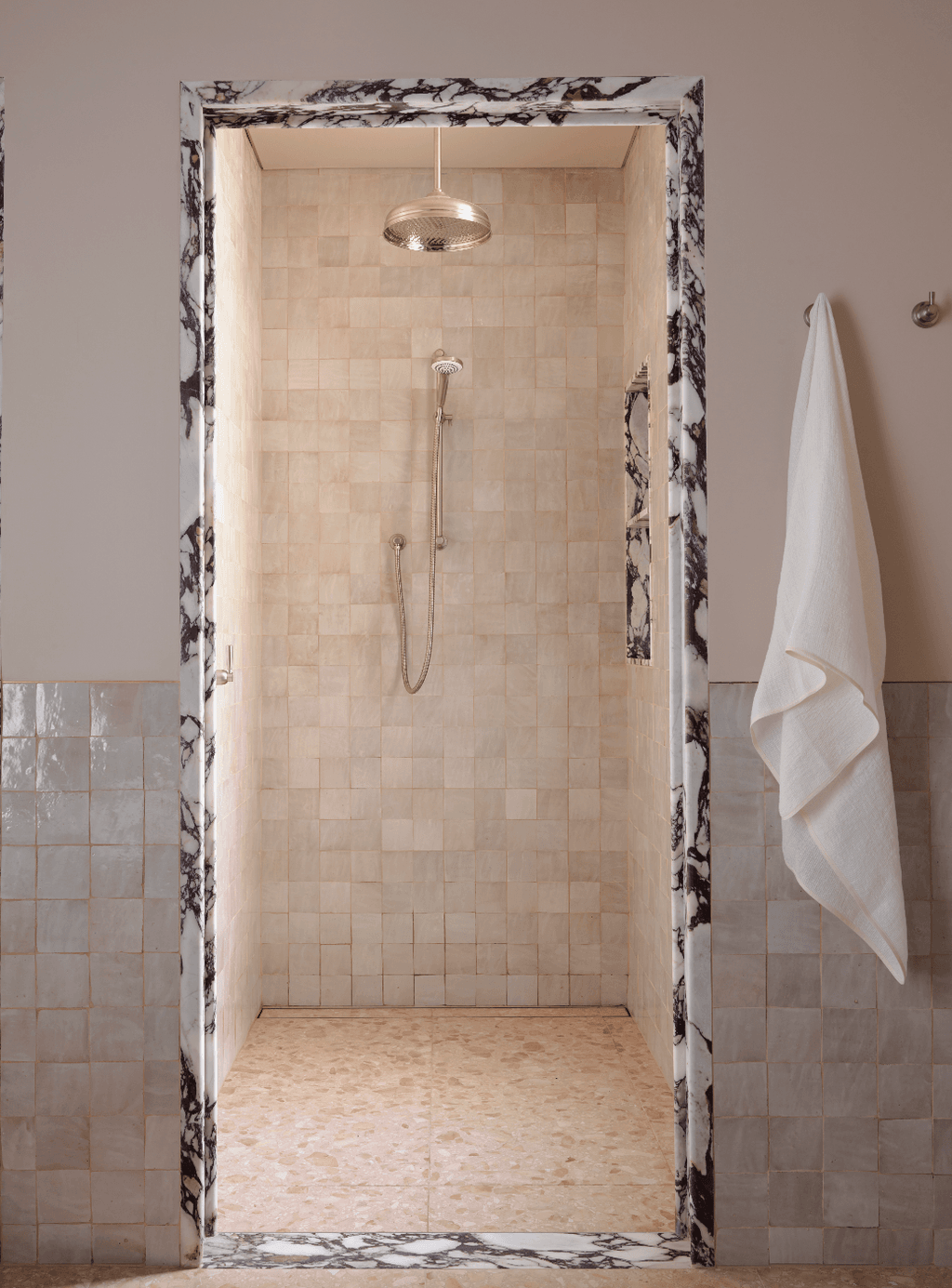 In this ArentsPyke project the bathroom is a graceful elegant room helped by the lightreflecting zellige tiles which...