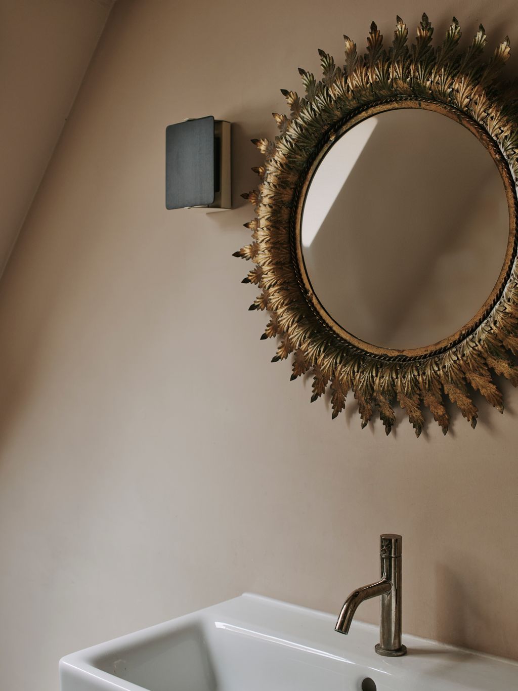 Cassandra found the sun mirror in the main bathroom on a whim at an antiques fair.