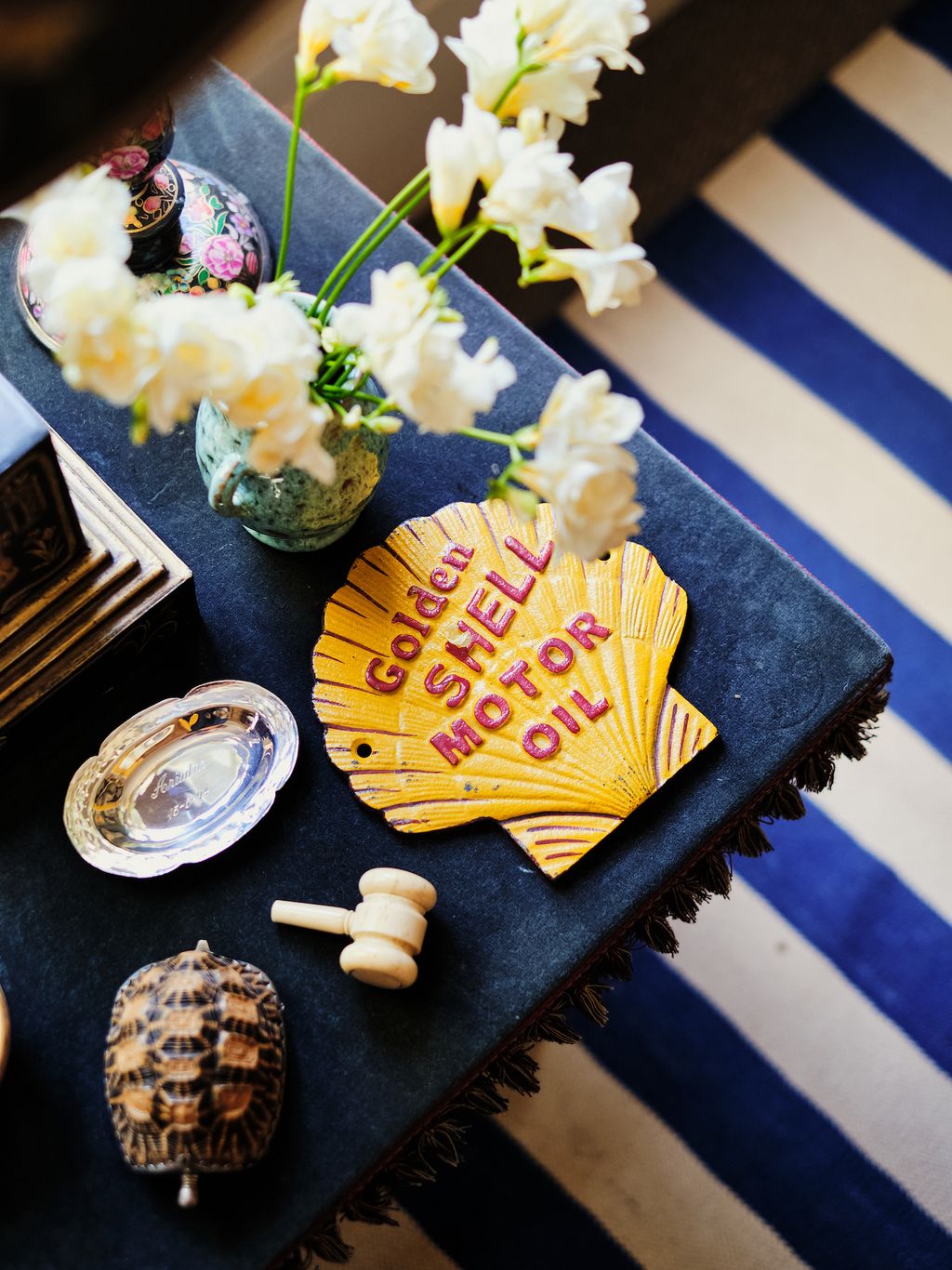 A silver dish from Ariadnes christening and an old gavel of their fathers from his time at Sothebys form the basis for a...