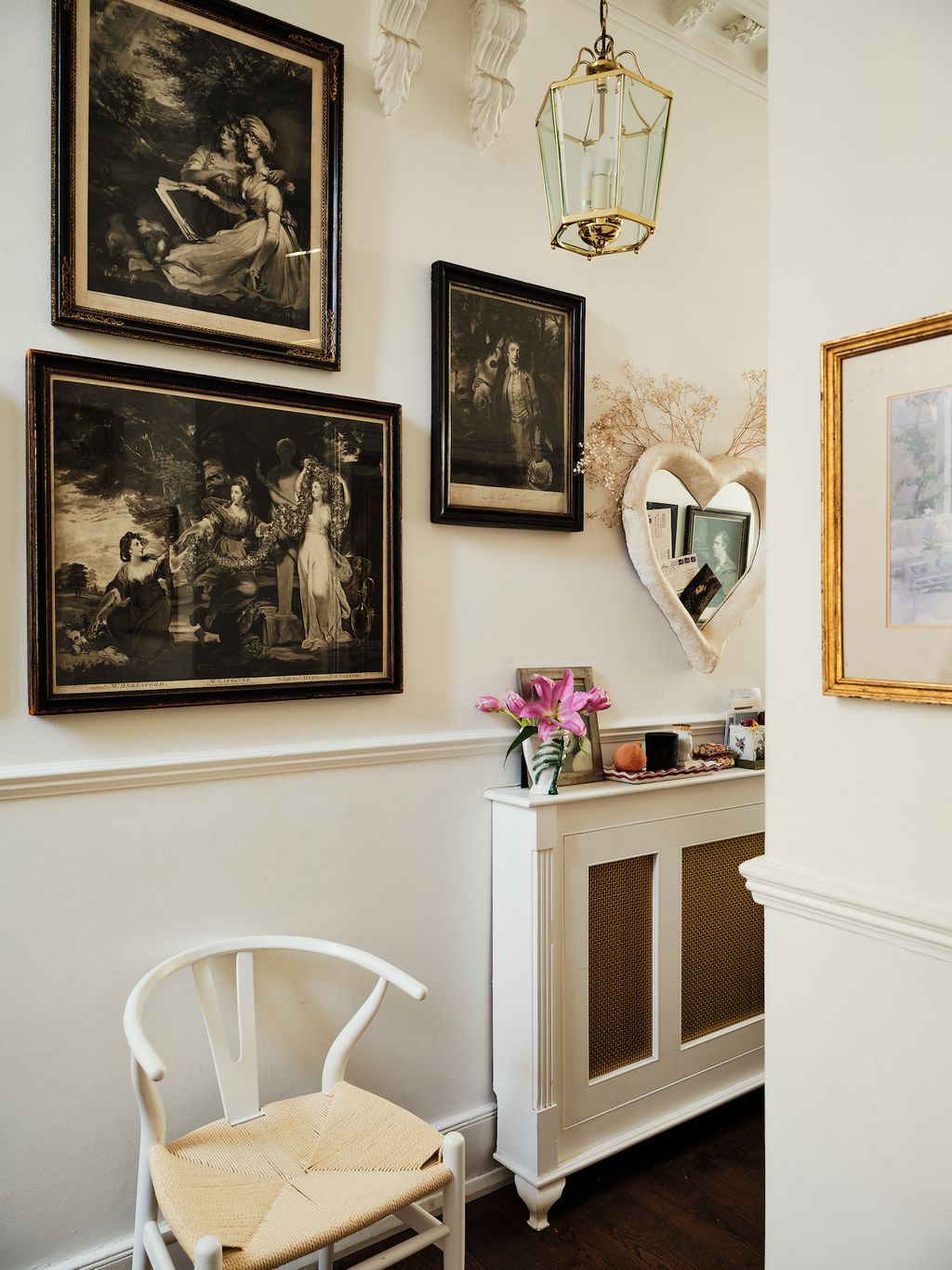Various 18th century mezzotints of famous paintings hang in the downstairs hallway. The paper mach heart mirror was made...