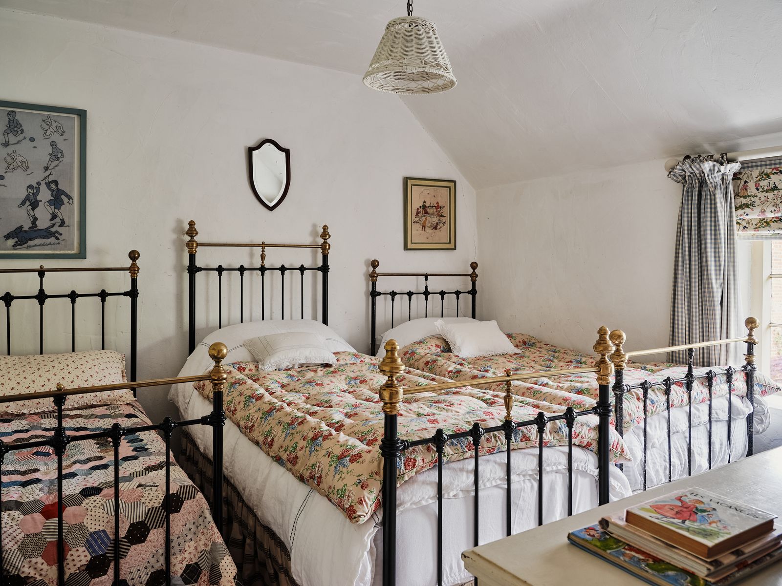 The children's bedroom which started off with one bed now has three squeezed into it. The bed on the left had to be...