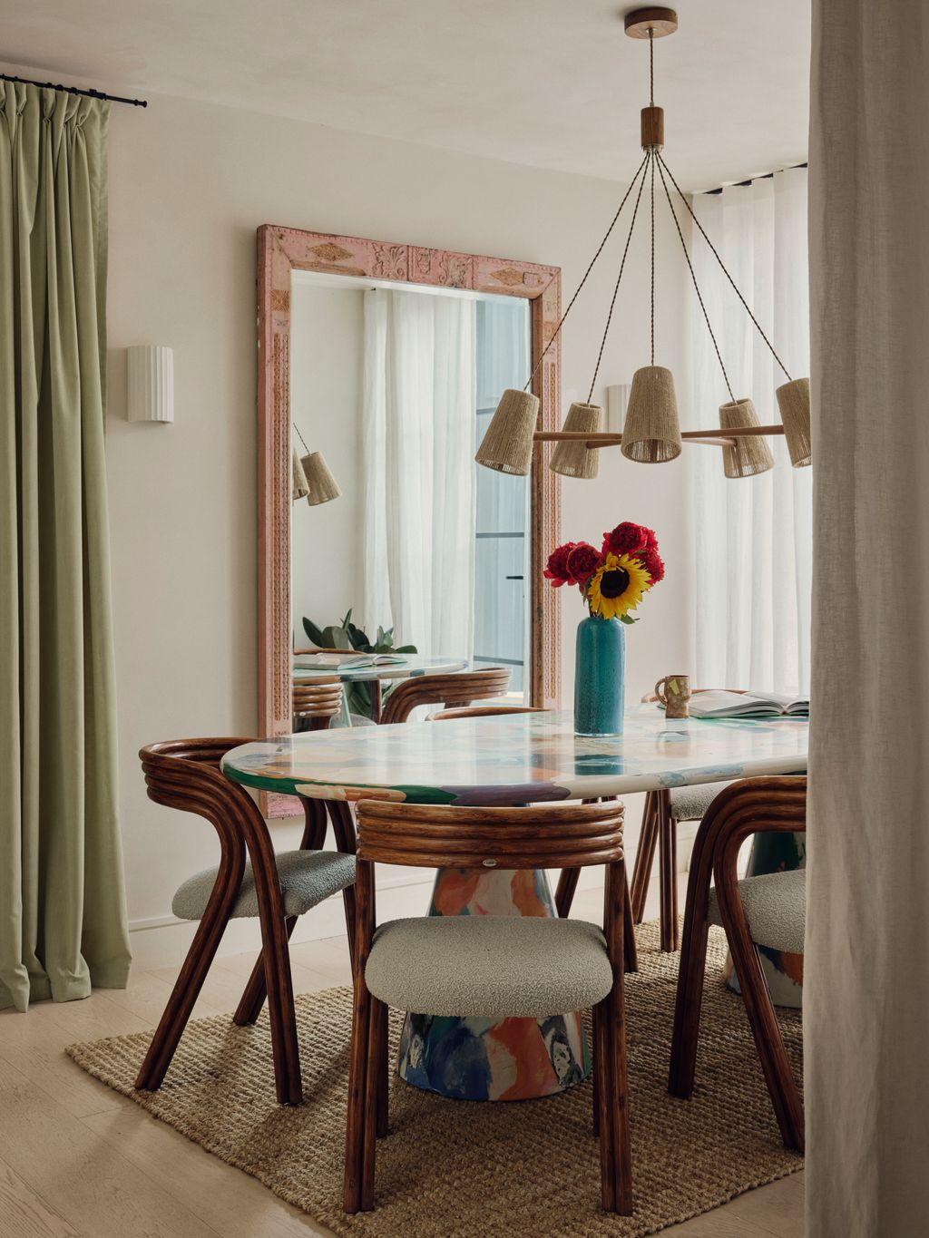 In the more formal dining area a Soho Home pendant hangs above a Dirk Van Der Kooij table. At the back of the room an...