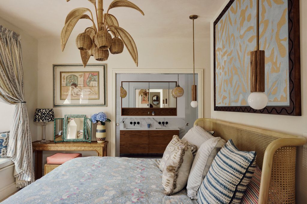 The bed is from Soho Home with a bedside table from Annämh Living. Hanging above the bed is an artwork made by Orlagh...