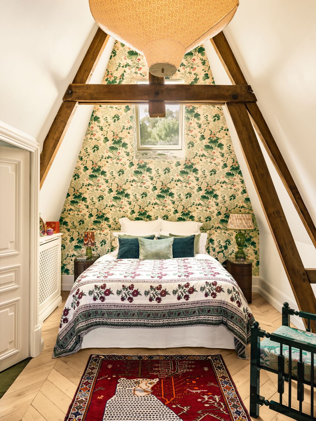 Cushions in Pierre Frey velvet tone with the bedcover in an eyecatching floral and the wall in ‘Althea in ivory both...