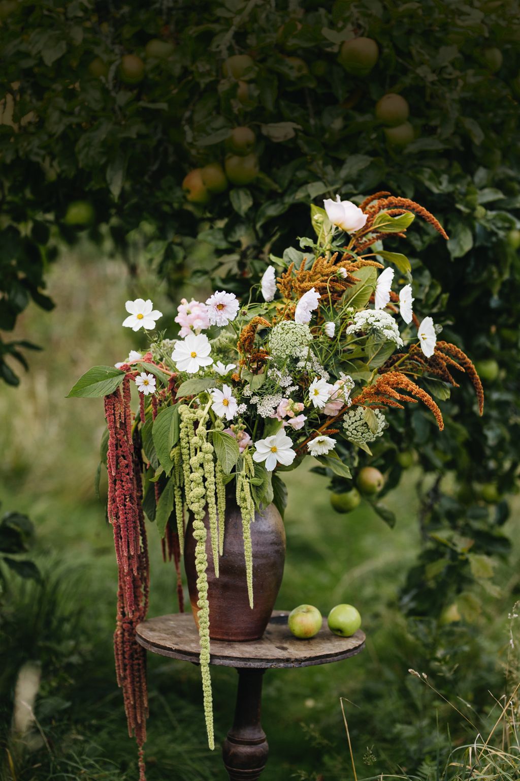 One of Millis naturalistic floral arrangements including Ammi majus cosmos Amaranthus caudatus ‘Coral Fountain and...