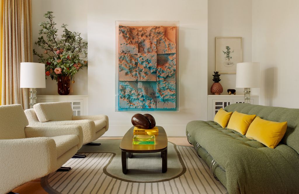 On the left in the sitting room of Schumacher CEO Benni Frowein's London flat is a pair of armchairs designed by Franz...