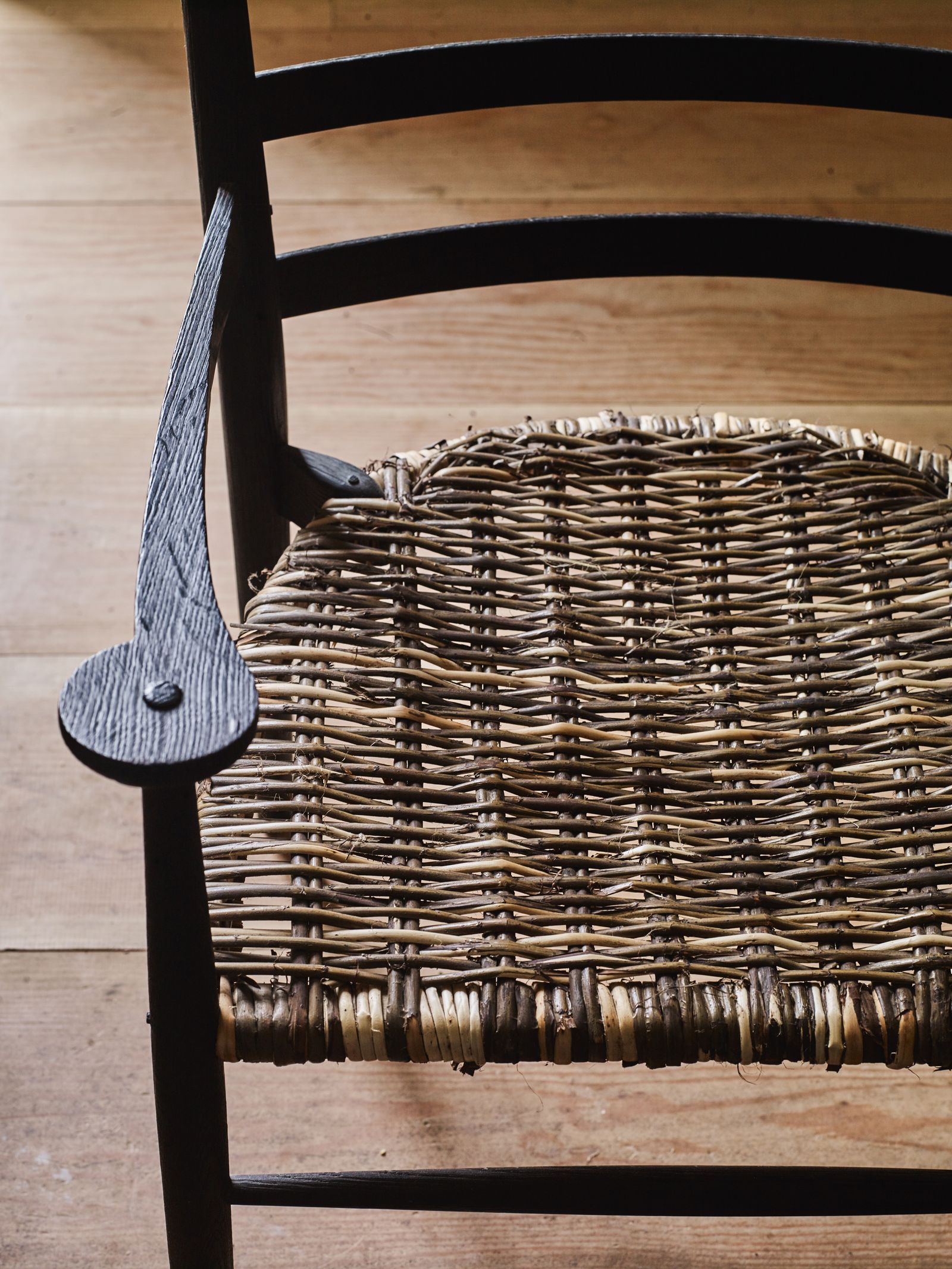 The woven willow seat of an ‘Ascend Reading chair
