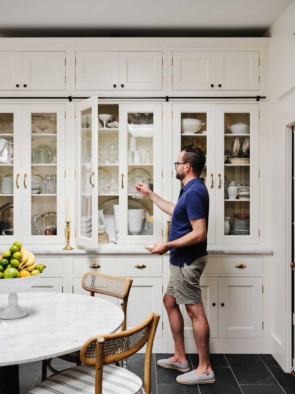 Kevin picks out a selection of glasses for dinner