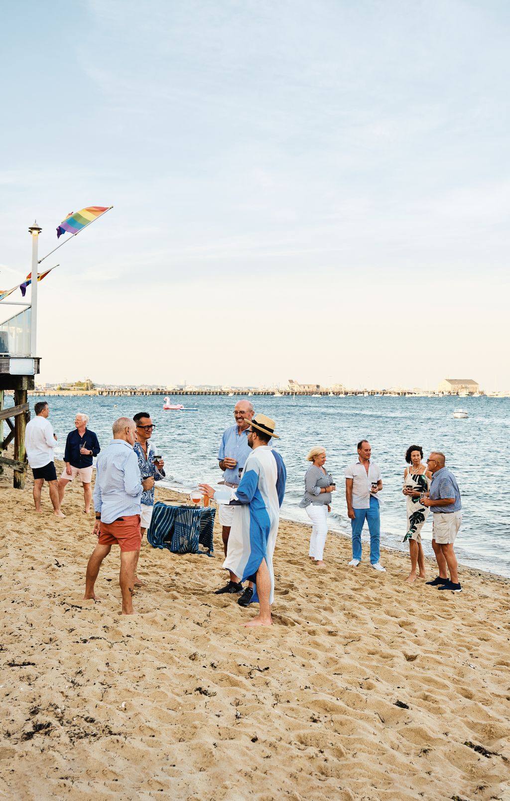 Enjoying a drink with friends on the beach at the end of their lane before Kevin leads guests into the couples house for...