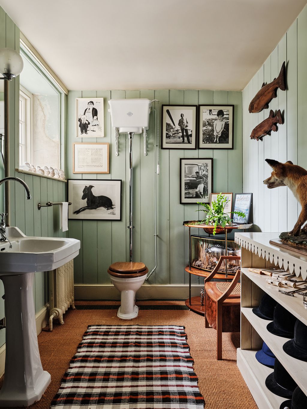 The downstairs bathroom walls are hung with old family photos and memorabilia.
