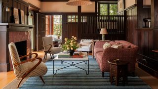 In the living room arenbspvintagenbspPaolo Buffa chairs in a Michael Smith fabric anbspPinch London sofa in a Robert...
