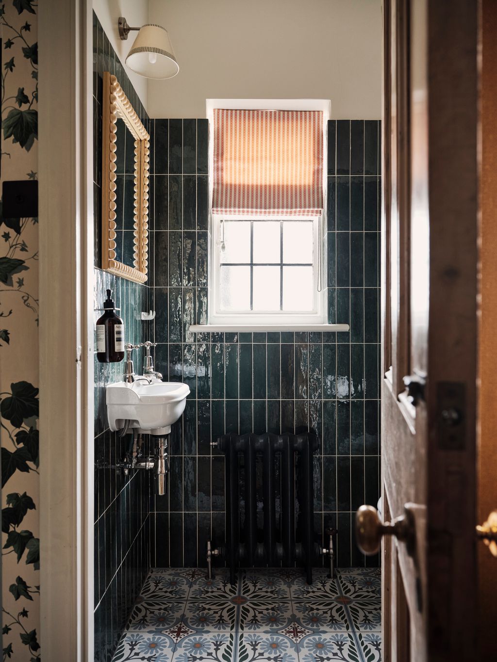 In the downstairs loo wall tiles in Mandarin Stone's ‘Hoxton complement Violetti's ‘Olivia Natura tiles on the floor.