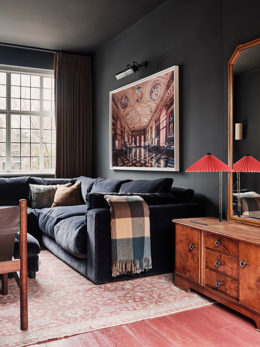 The TV room is painted in ‘Charbonne from Paint  Paper Library with curtains in Holland and Sherry's ‘Patagonia Flax. An...