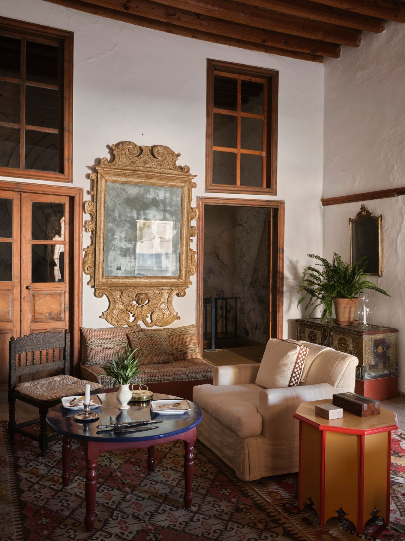 The windows above the doors typical of Patmos give light to the rooms beyond.