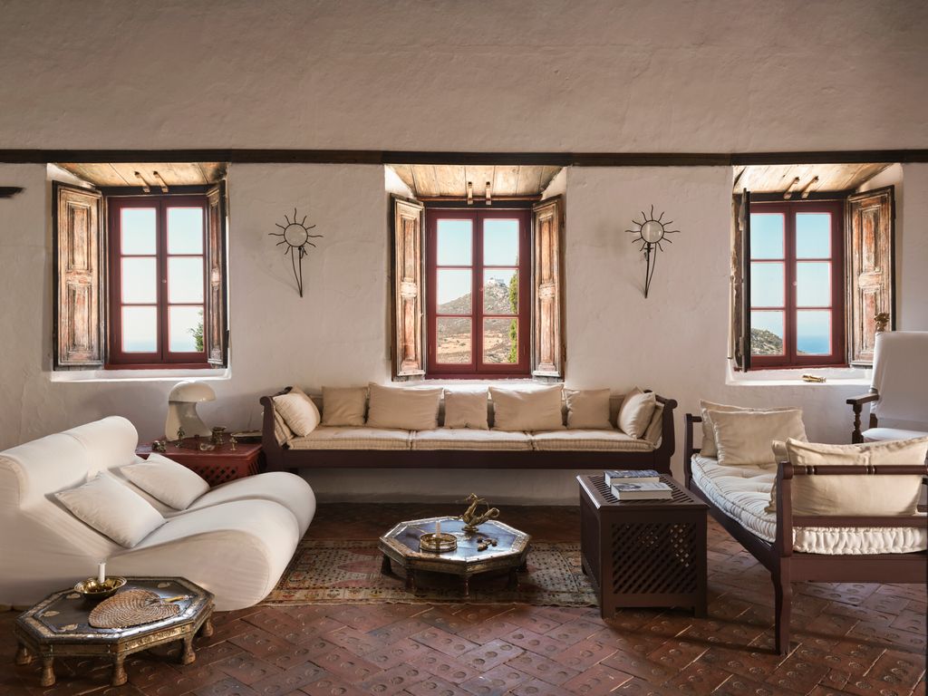 This room has a sense of repose and purity. A stark room it nevertheless has the There is a glint of brass from low...