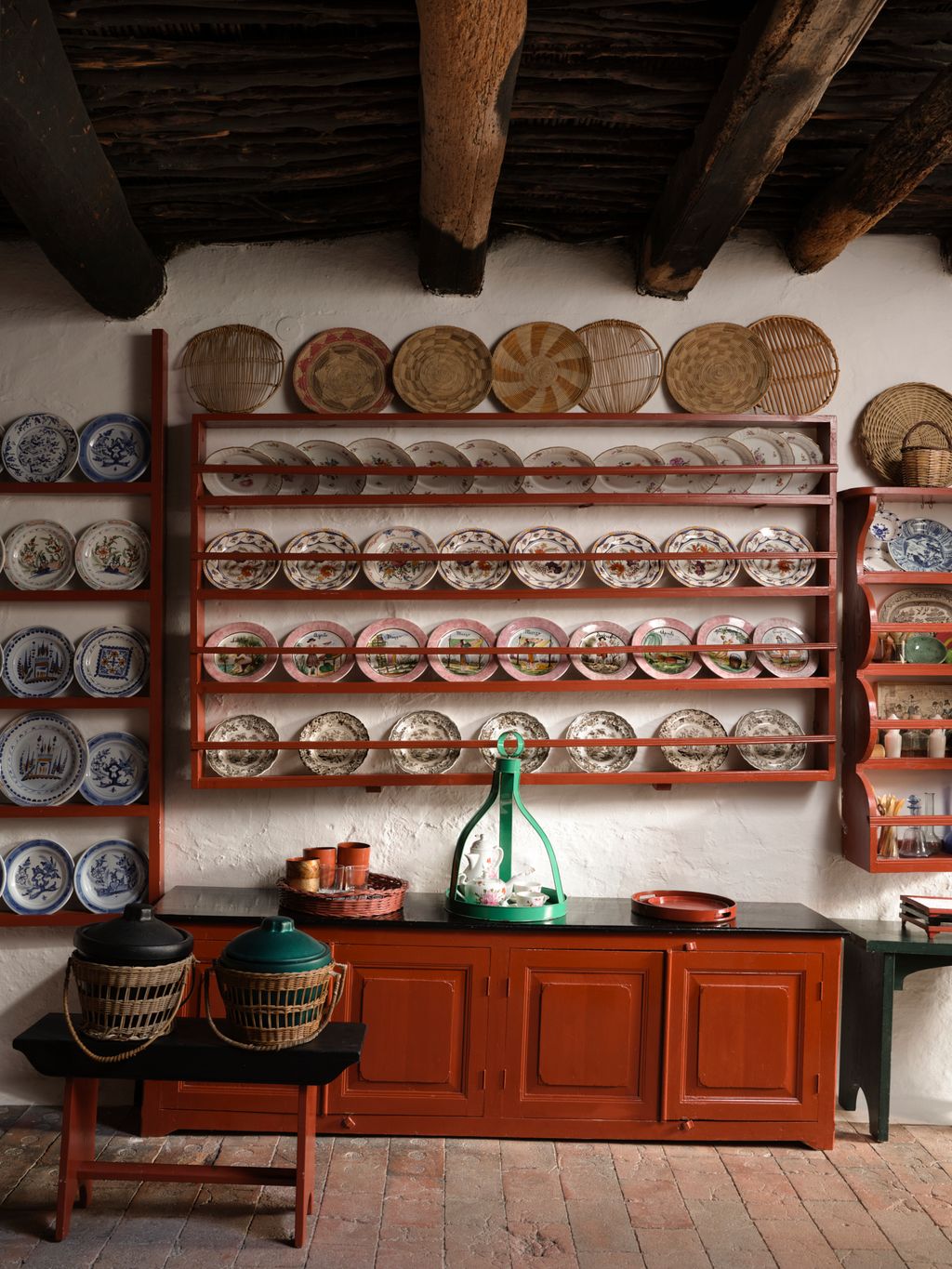 On the rack are collections of plates some from the island of Skyros others a set of plates depicting the seasous from...