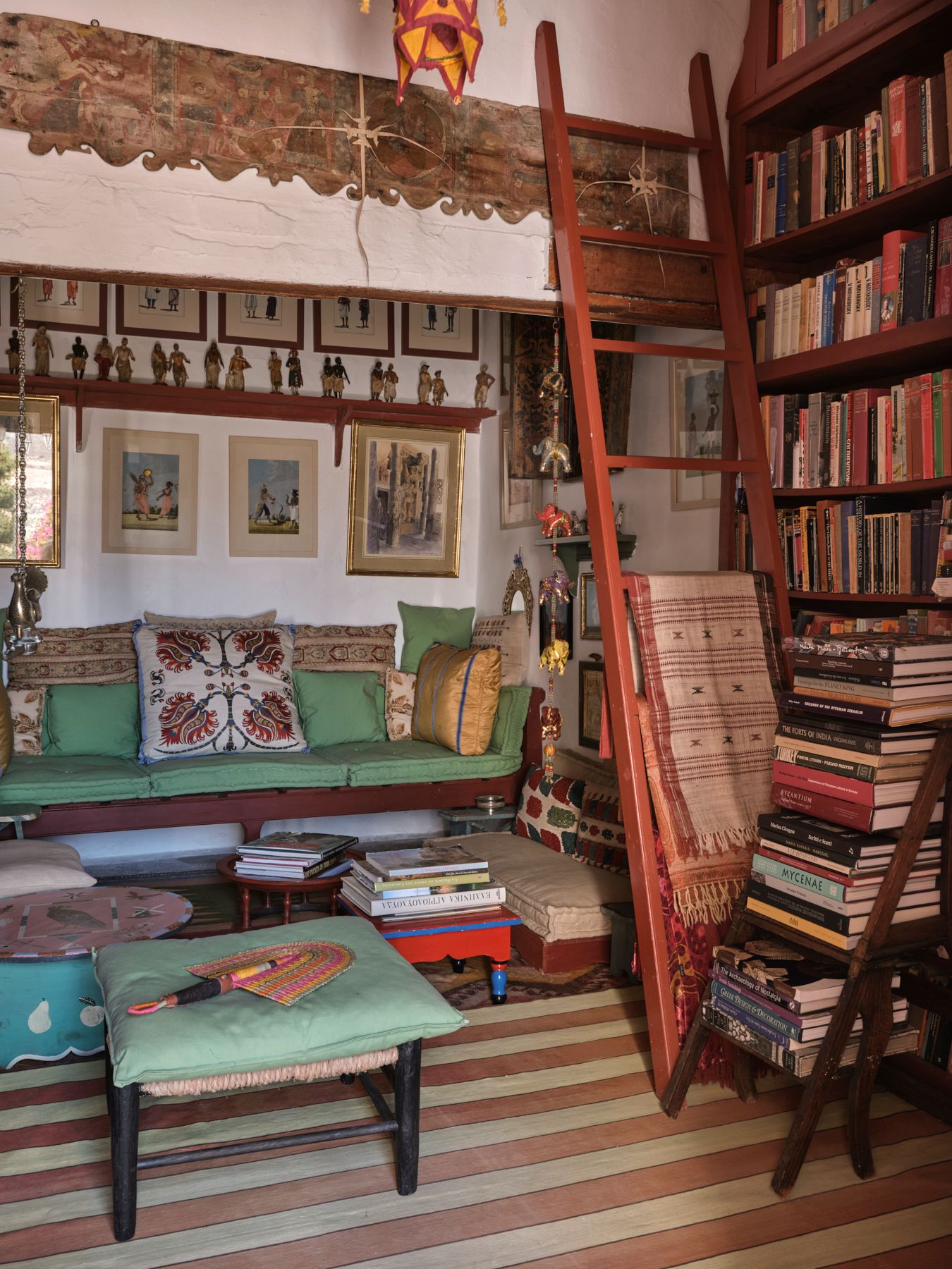 The small library at the heart of the first floor is full of books. Indian miniatures line the walls. The central...