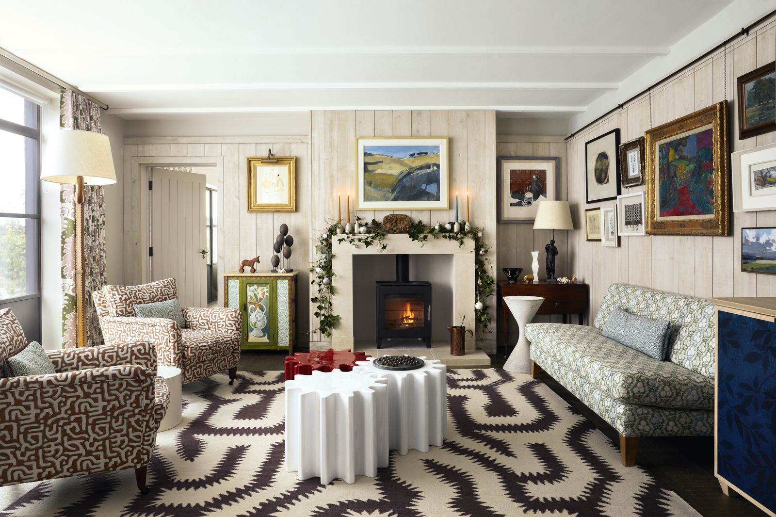 In the sitting room a pair of 1930s armchairs reupholstered in Rapture amp Wrights ‘Kuba linen in burnt sienna and an...