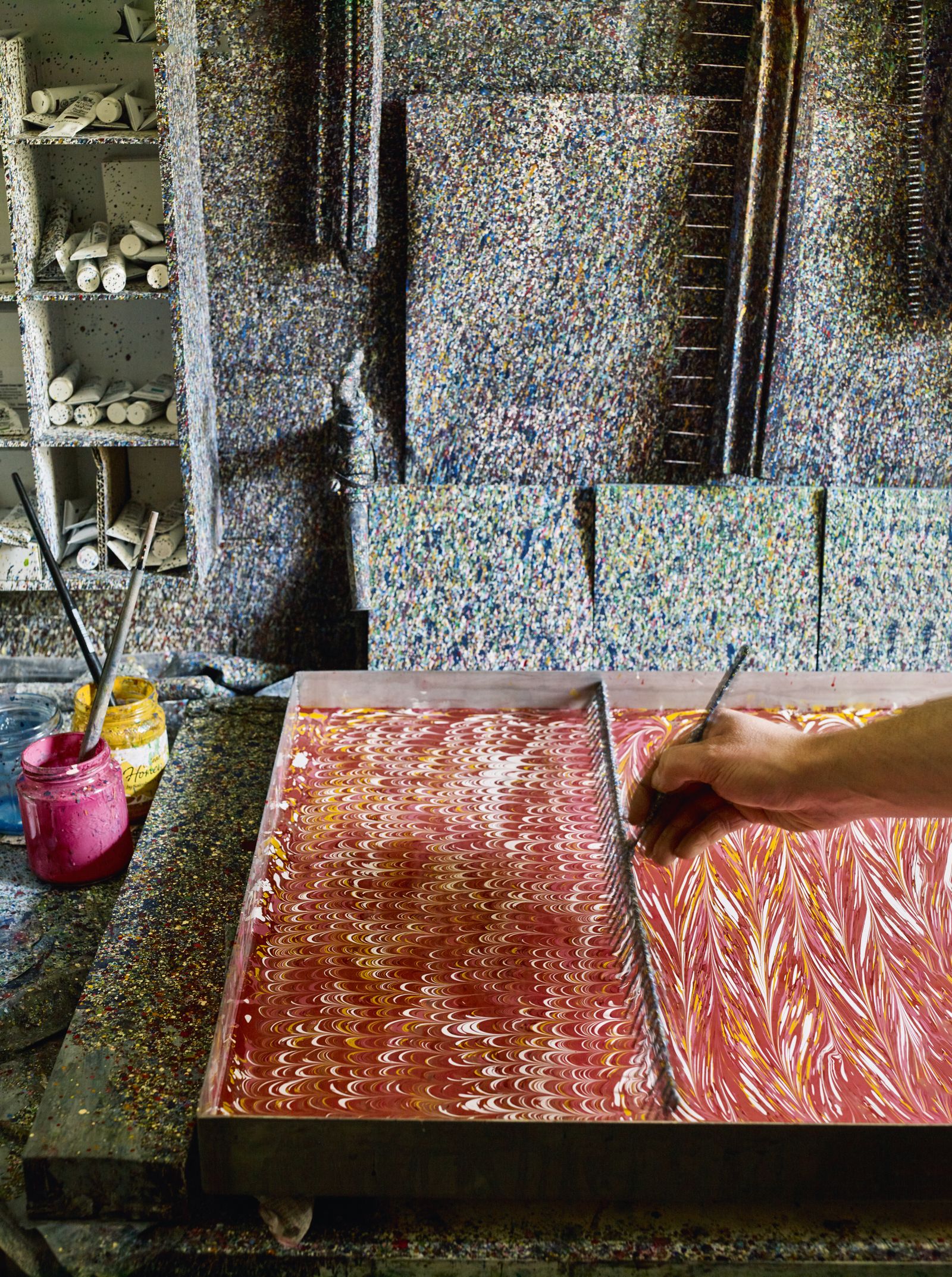 Marbled papers are created by Alex in the studio using a waterbased method