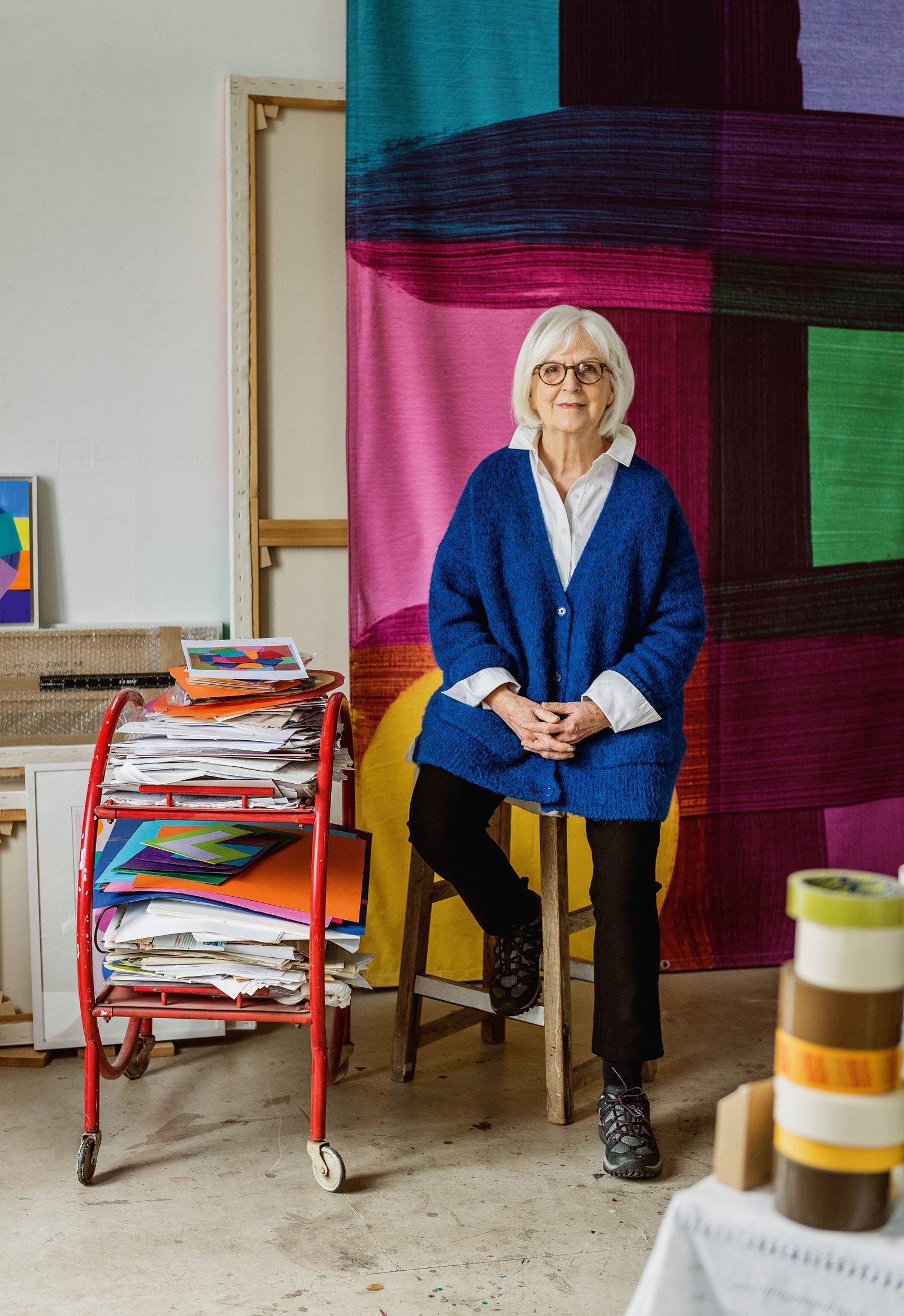Mali in her warehouse studio in front of one of 33 flags that she created to hang above Bond Street W1 in summer 2022 as...