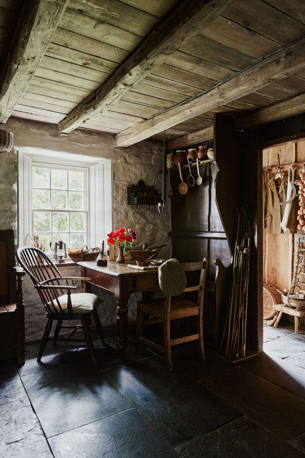 This corner of the living room is separated from the entrance hall by a partition of interwoven timber panelling. Dorian...