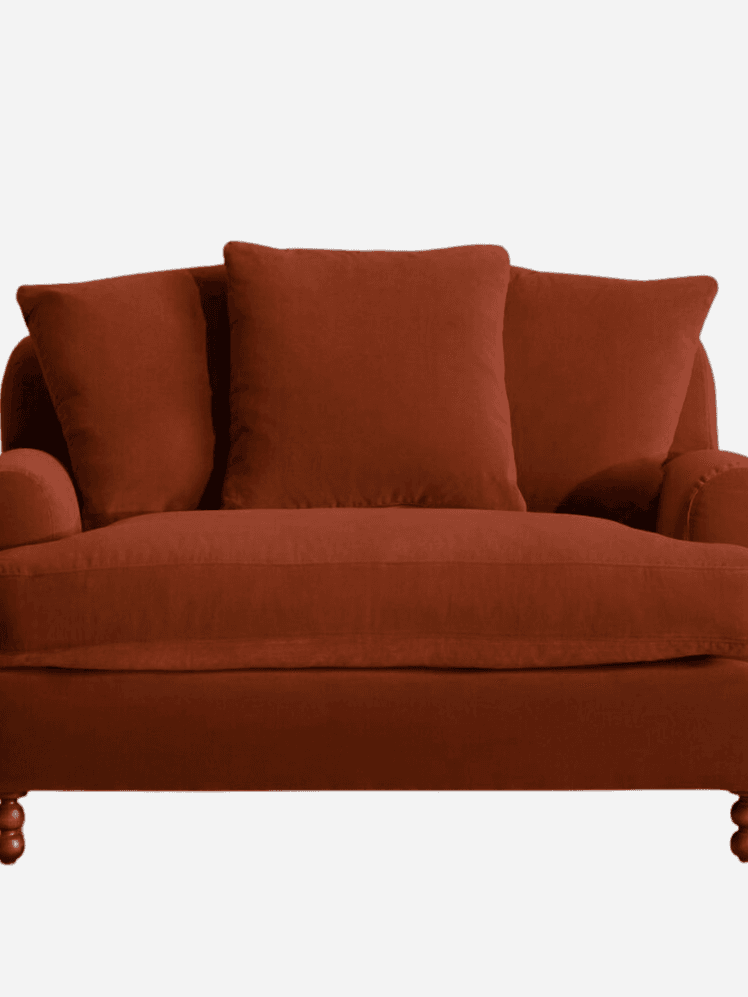 Image may contain: Couch, Furniture, Cushion, Home Decor, Chair, and Armchair