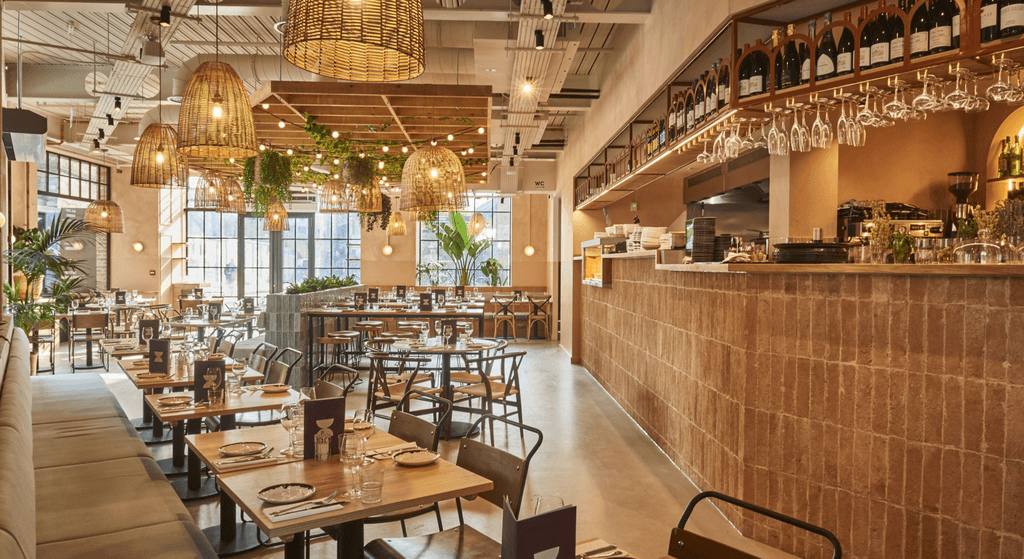 Image may contain Indoors Restaurant Interior Design Bar Cafeteria Architecture Building Furniture and Lounge