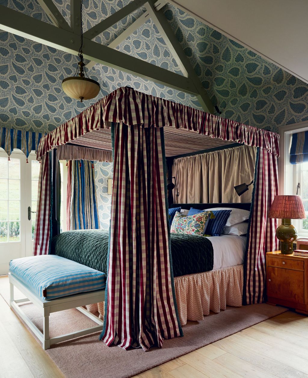 Image may contain Furniture Indoors Bed Bedroom Room Lamp Home Decor Rug and Canopy Bed