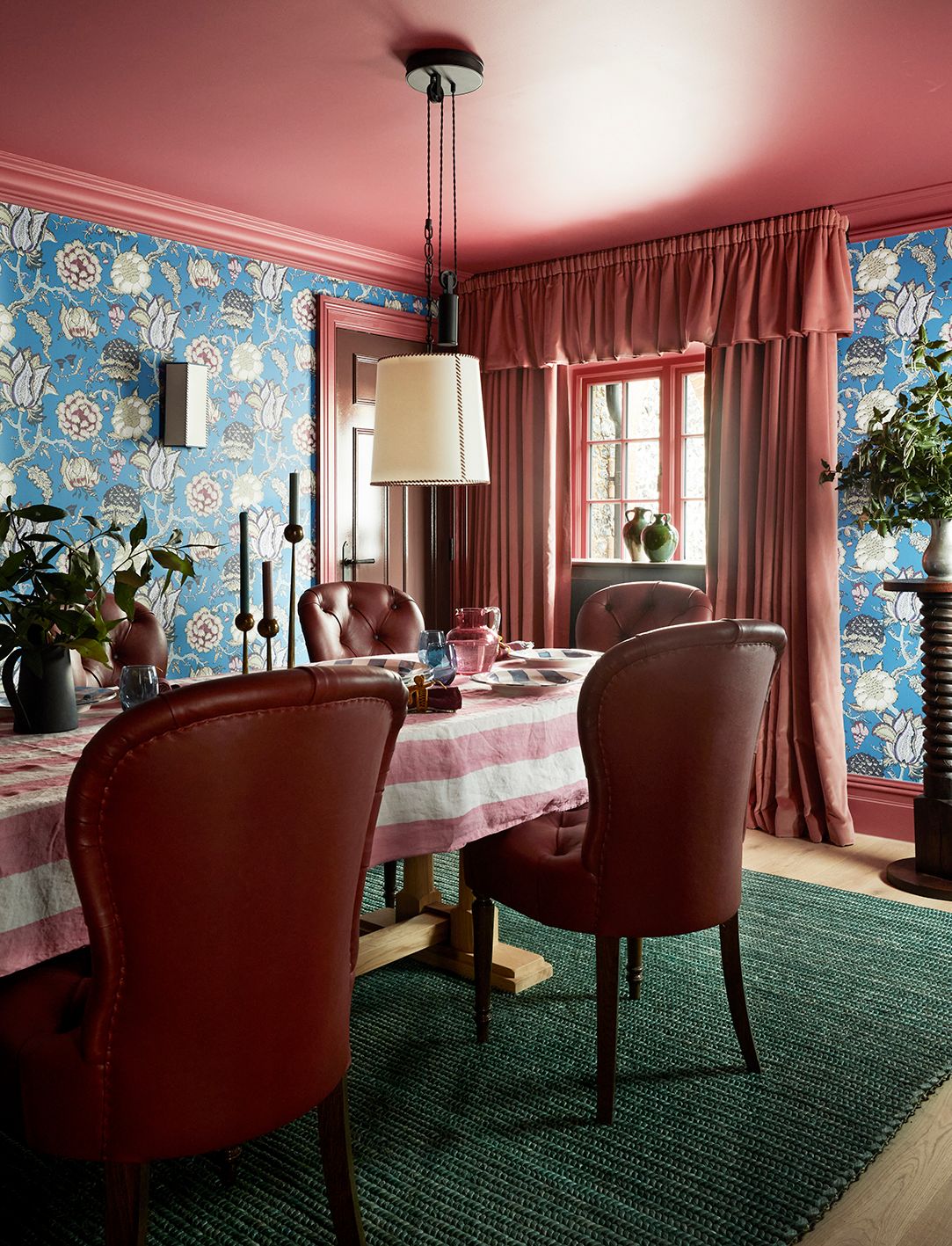 Image may contain Architecture Building Dining Room Dining Table Furniture Indoors Room Table Lamp and Home Decor