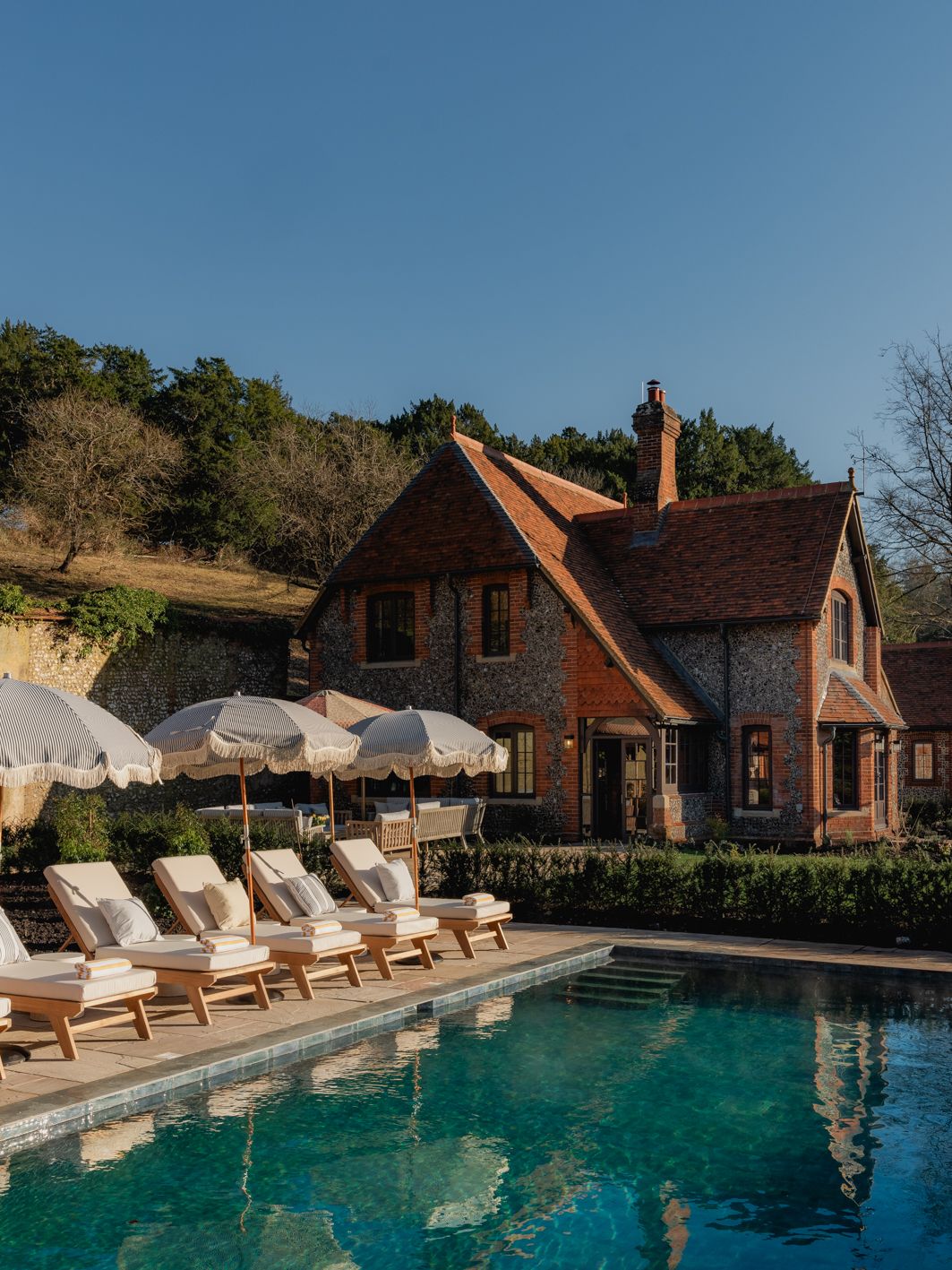 Image may contain Pool Water Chair Furniture Swimming Pool Architecture Building Hotel Outdoors House and Housing