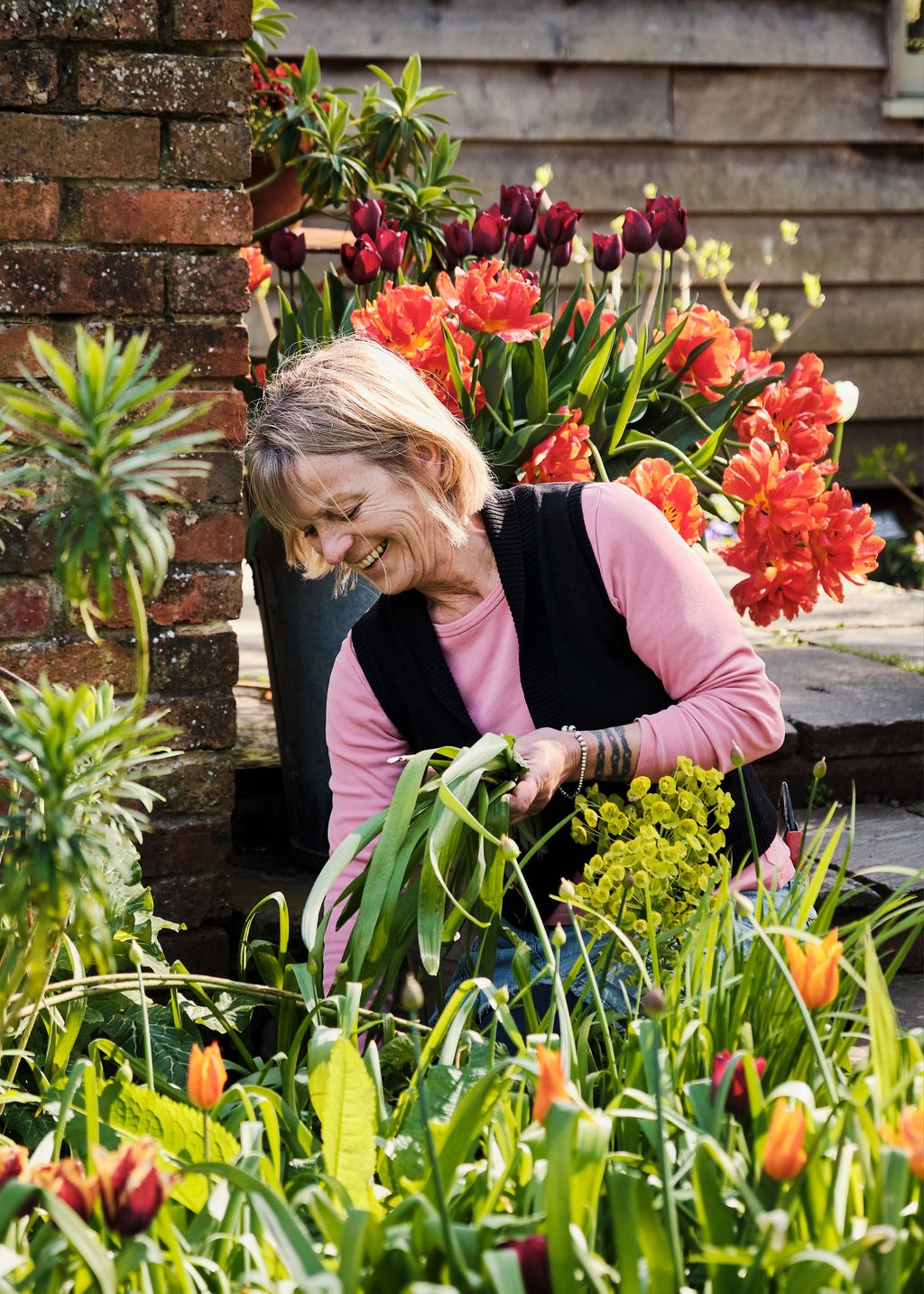 Image may contain Garden Nature Outdoors Plant Potted Plant Face Head Person Photography Portrait and Gardening