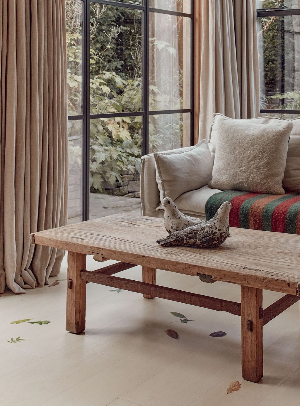 Image may contain Furniture Table Coffee Table Tabletop Desk Indoors Interior Design Wood Hardwood Animal and Bird