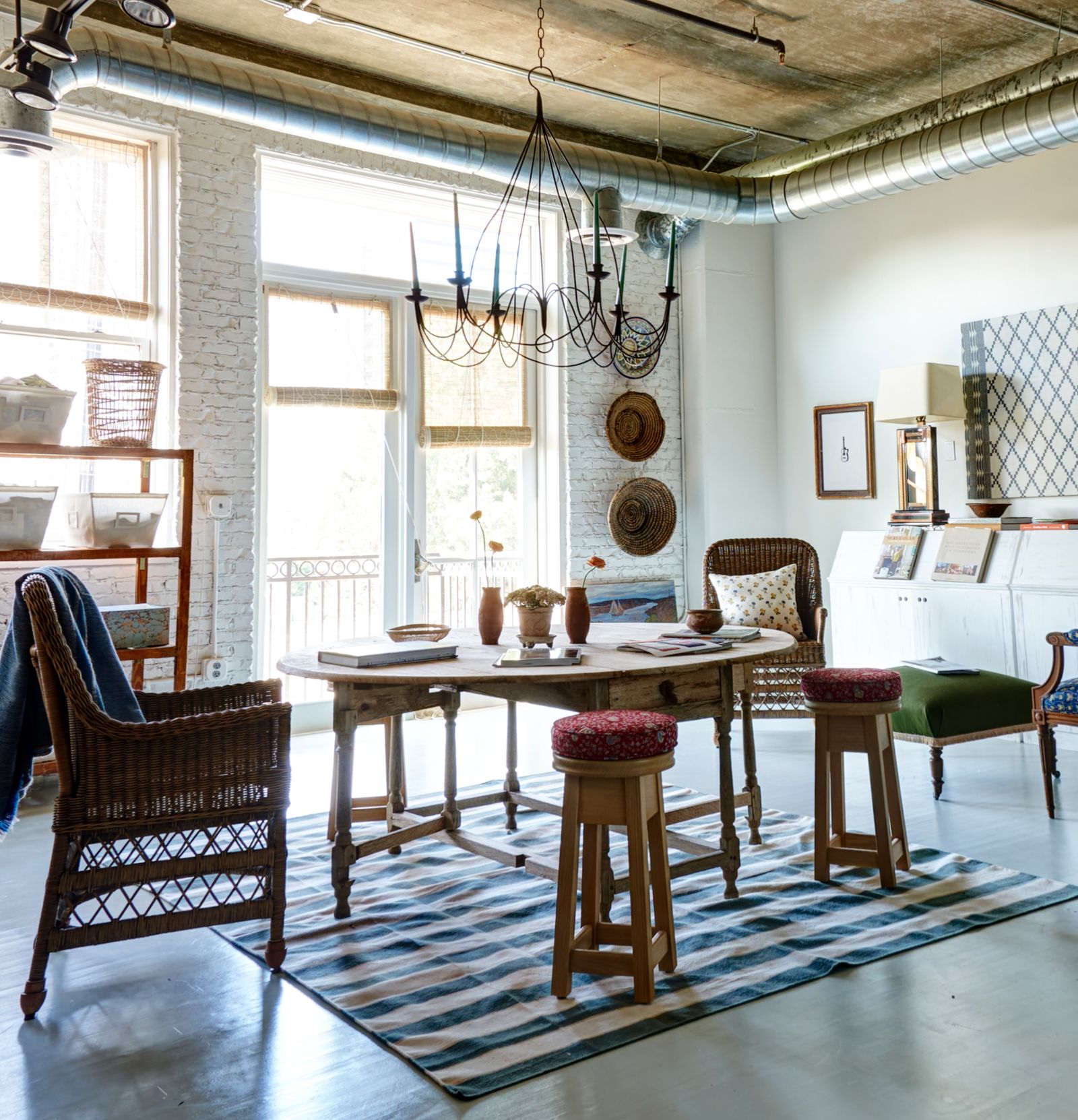 Image may contain Home Decor Lamp Architecture Building Dining Room Dining Table Furniture Indoors Room and Table