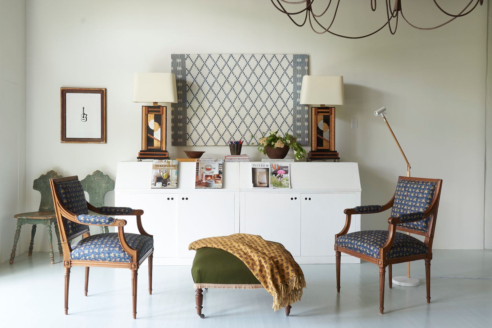 Image may contain Chair Furniture Lamp Indoors Interior Design Plant Home Decor Book and Publication