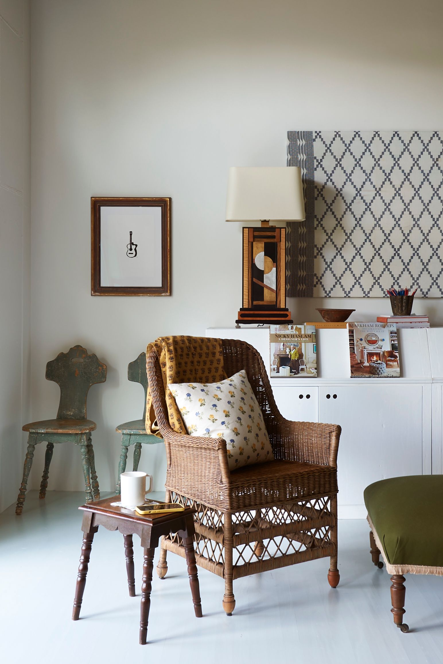 Image may contain Chair Furniture Indoors Interior Design Cup Home Decor Cushion Lamp Architecture and Building