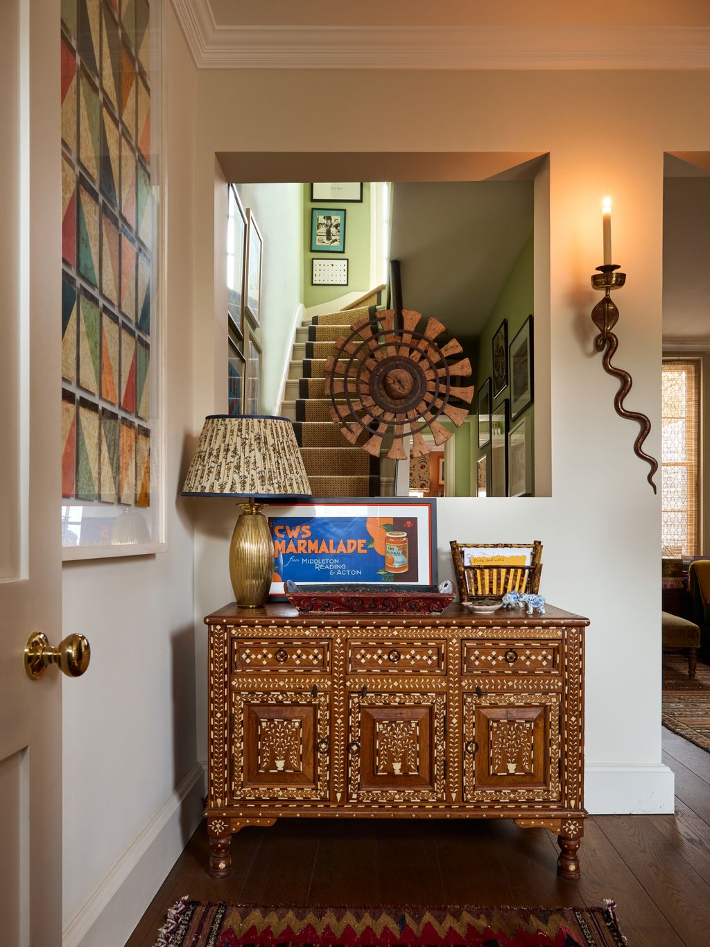 Image may contain Furniture Sideboard Corner Indoors Interior Design Lamp Home Decor Rug Art Painting and Candle