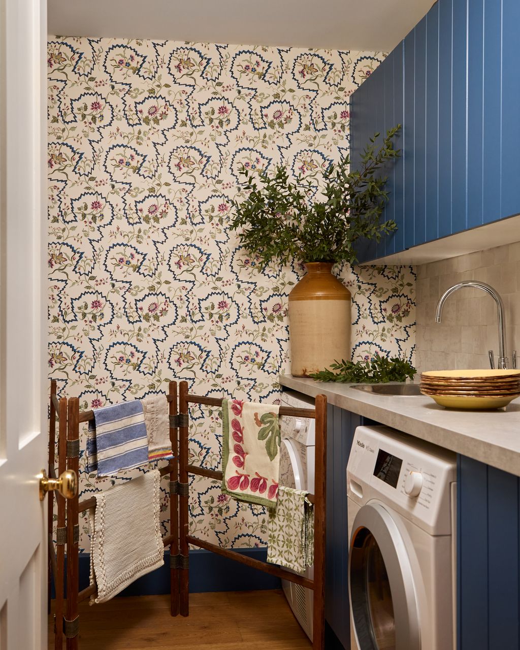 Image may contain Indoors Interior Design Appliance Device Electrical Device Washer Sink Sink Faucet and Laundry