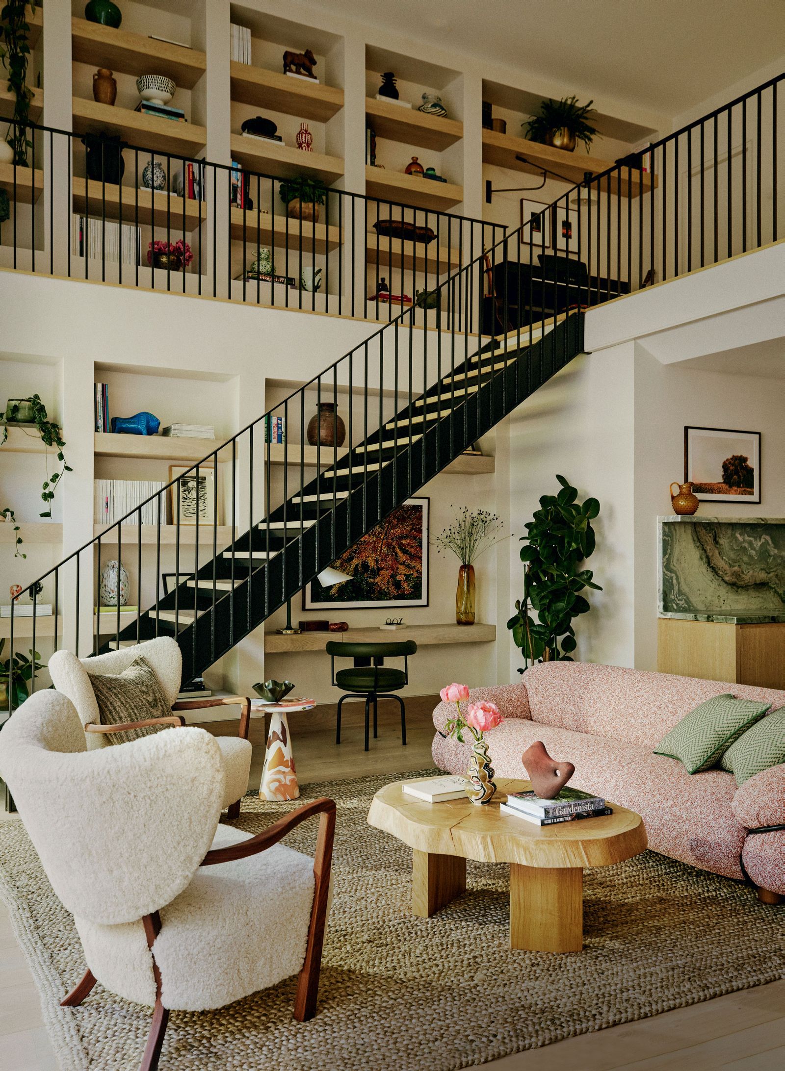 Image may contain Architecture Building Furniture Indoors Living Room Room Plant Couch Chair Home Decor and Rug