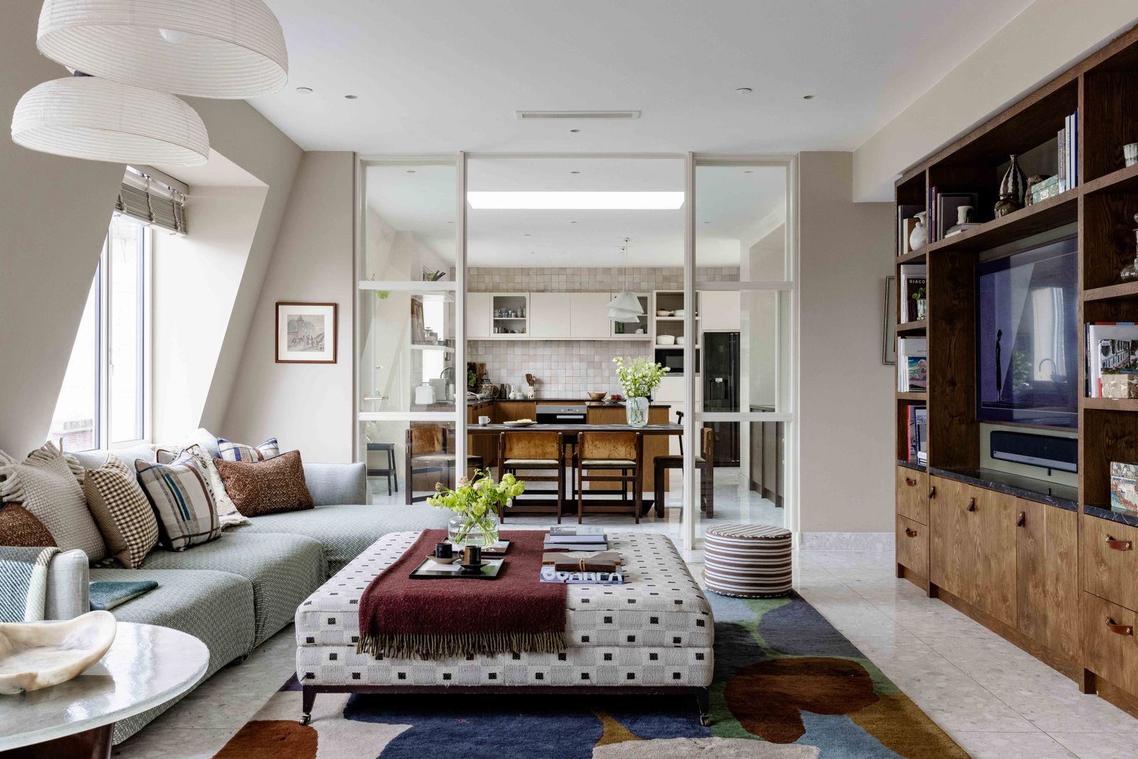 Image may contain Home Decor Architecture Building Furniture Indoors Living Room Room Art Painting Plant and Lamp