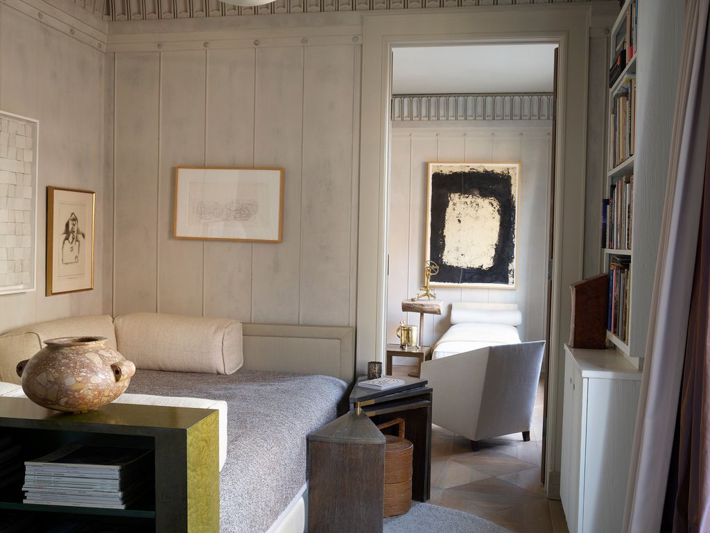 A Ruhlmann alabaster pendant and a Marco Kench painting from 2012 over a custom daybed in Sills bedroom.