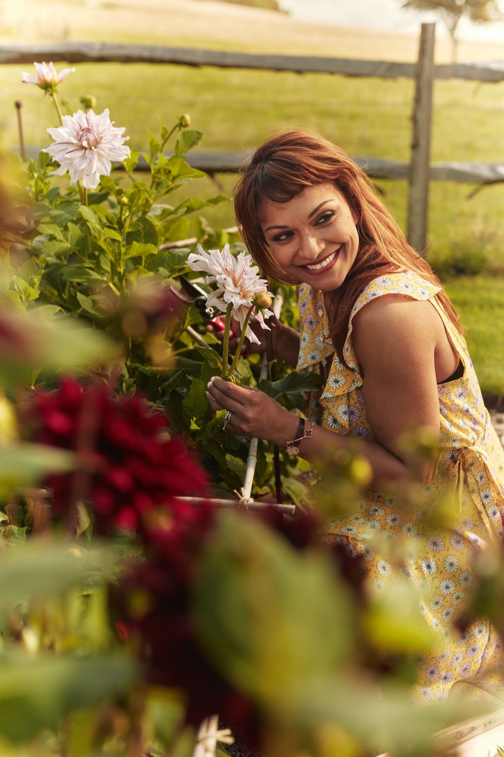Image may contain Danielle de Niese Face Head Person Photography Portrait Garden Nature Outdoors Flower and Petal