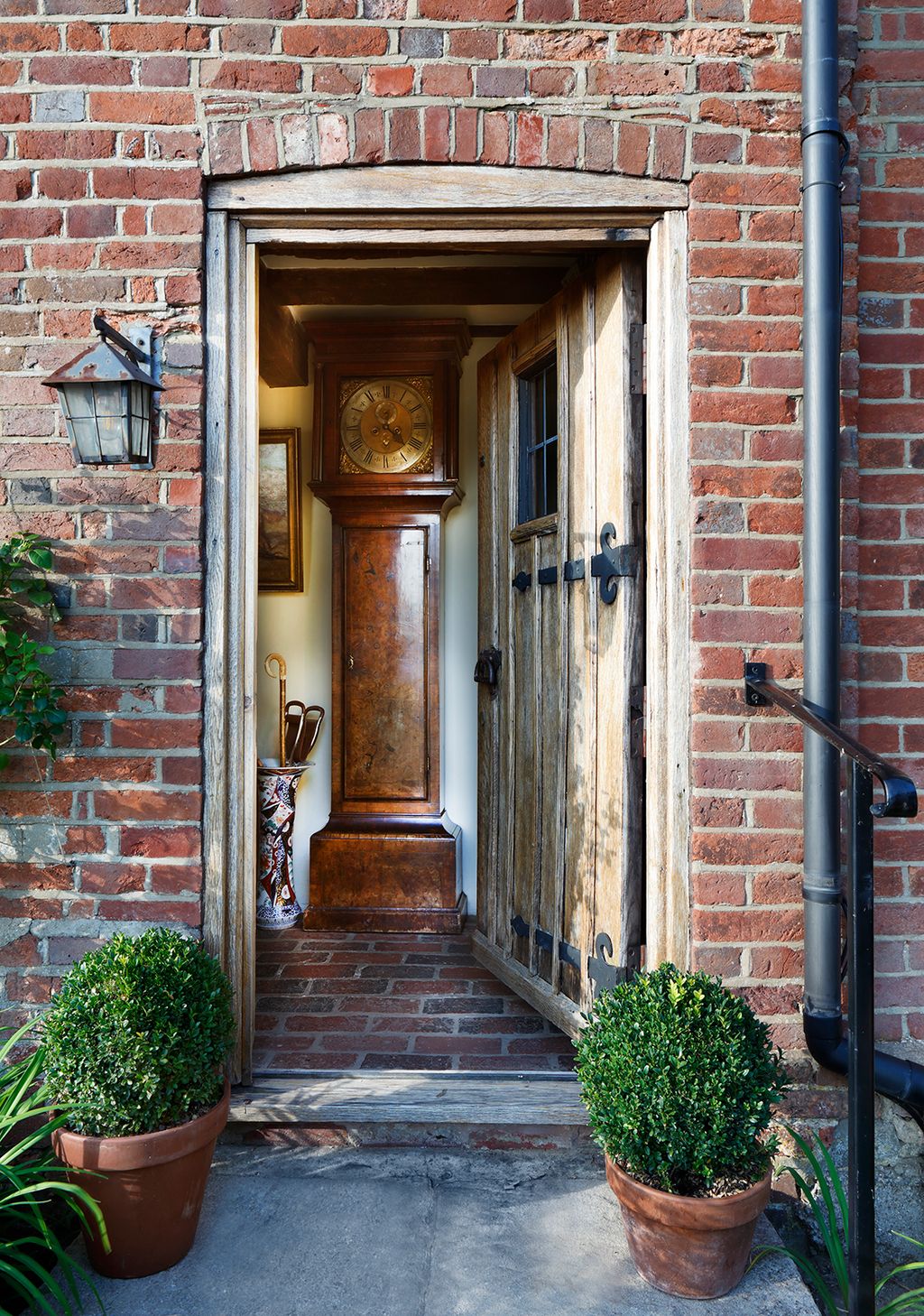 Image may contain Plant Lamp Indoors Interior Design Art Painting Door Architecture Building Housing and Brick